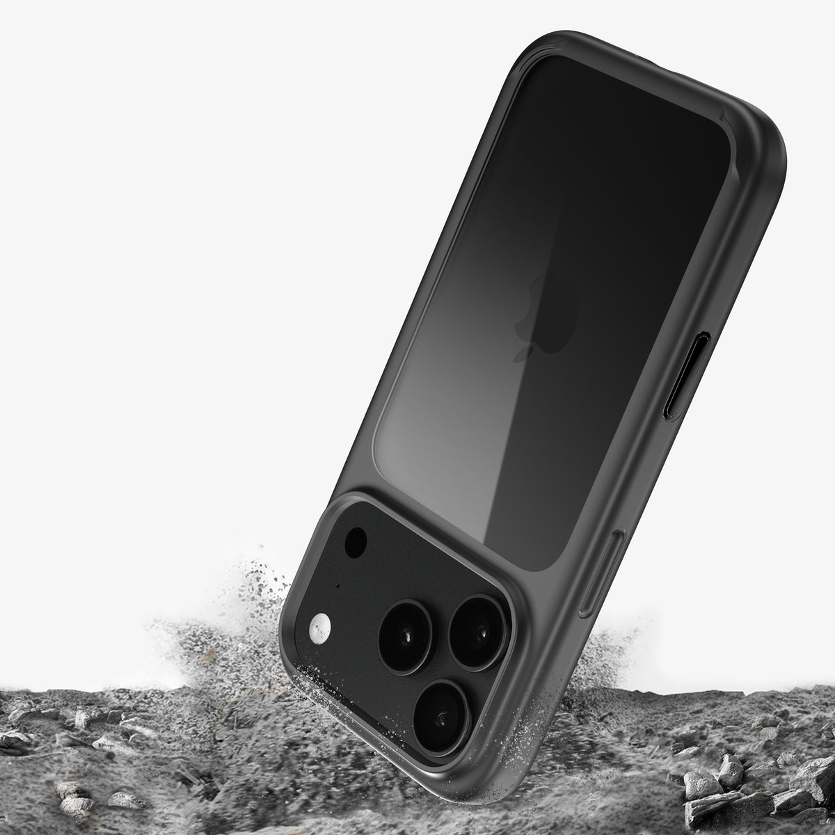 Coque ONE bumper pour iPhone 18 Pro et Pro Max sur un téléphone noir, illustration d’une chute sur un sol rocheux